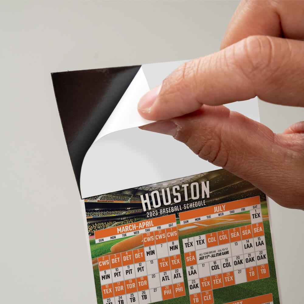 Peel and stick top on a baseball schedule, peeling off the protective sheet to expose the adhesive