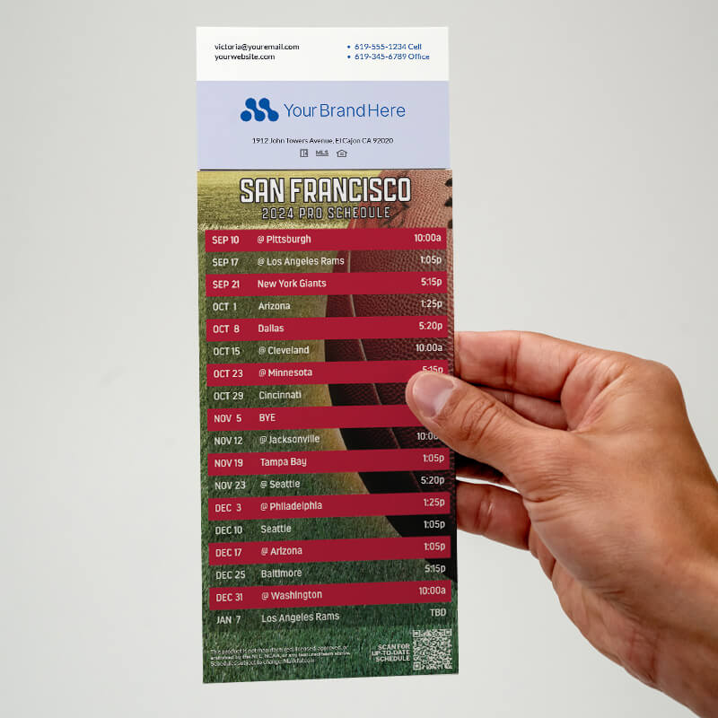 Your business card applied with adhesive to the top of a football schedule